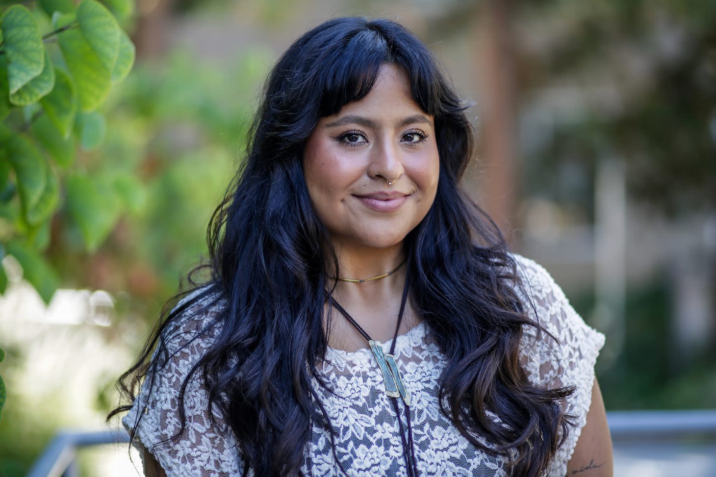A woman with long brown hair smiles. She is Daniela Rodriguez.