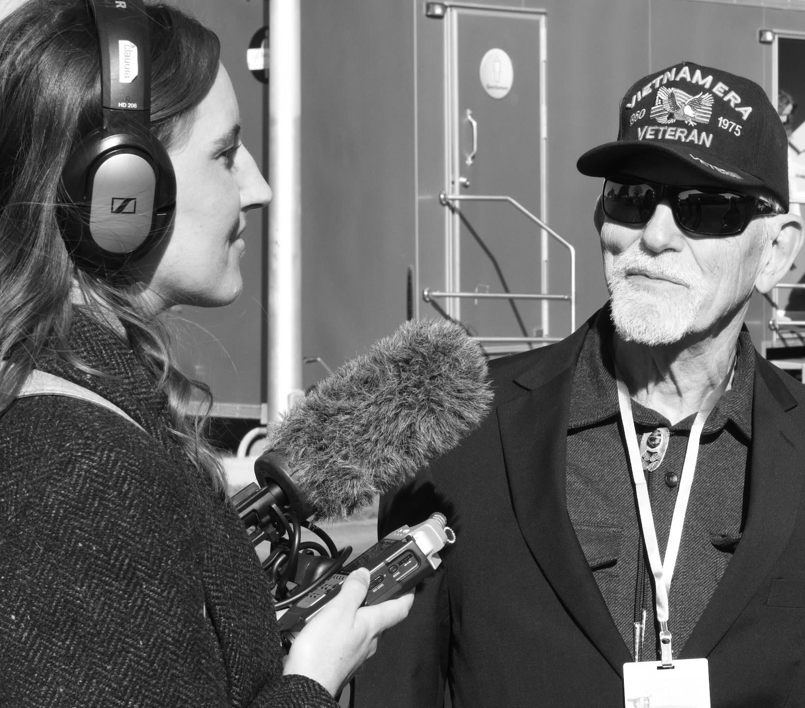 black and white image of fellow interviewing veteran
