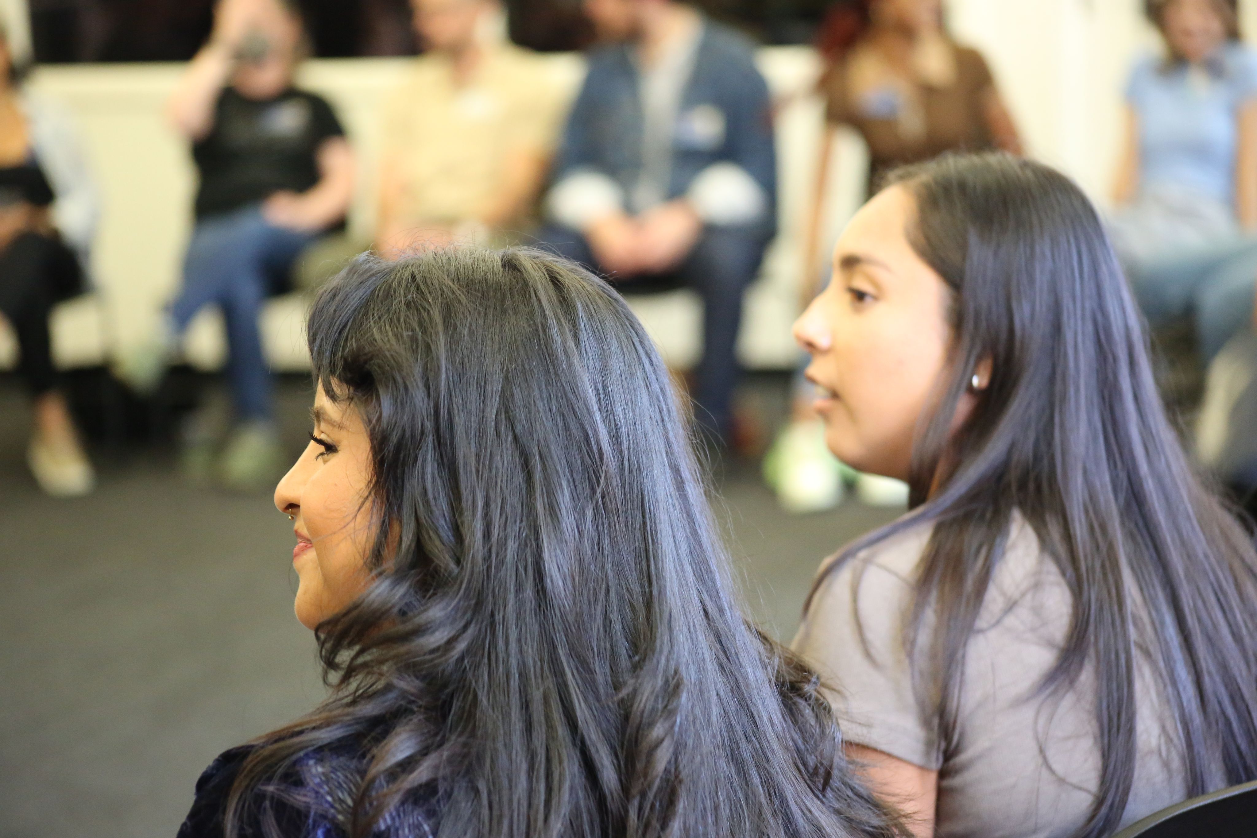profile of a young woman's smiling face. 