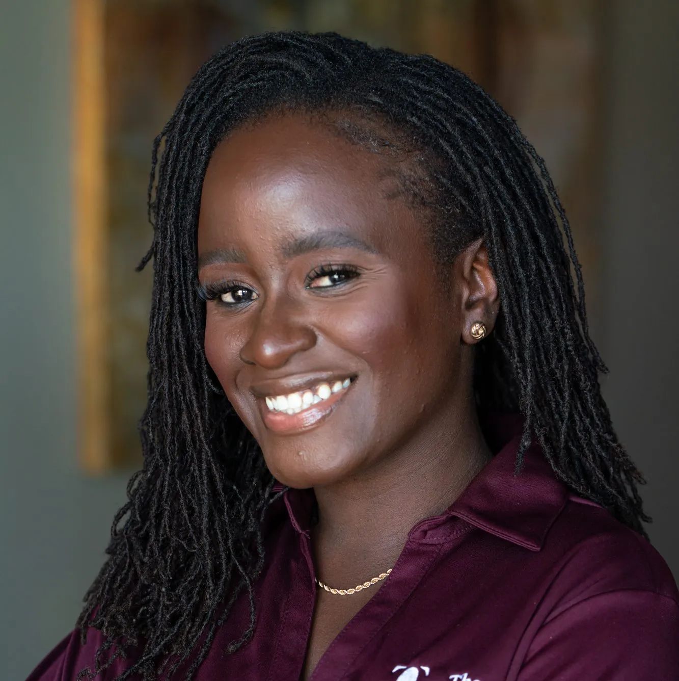 Williamena Kwapo headshot of her smiling. 