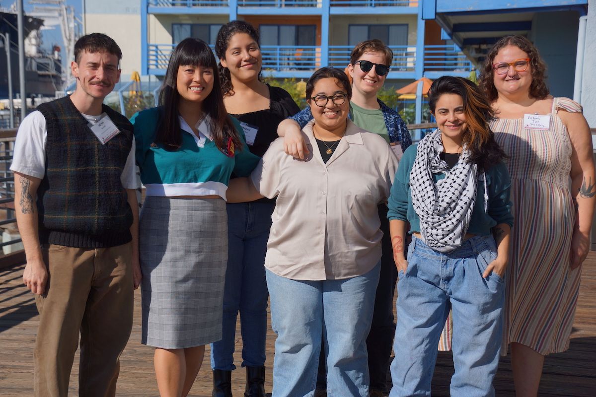 A group of people who are fellows in Southern California newsrooms pose for the camera.