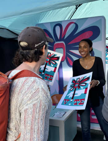 Photo of Professor Lisa Armstrong engaging with community members