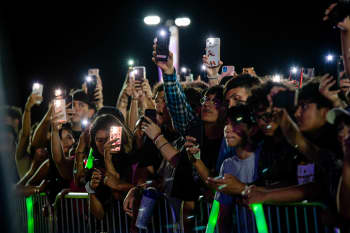 Photo of audience members watching a Mexican band perform before the 2024 US elections