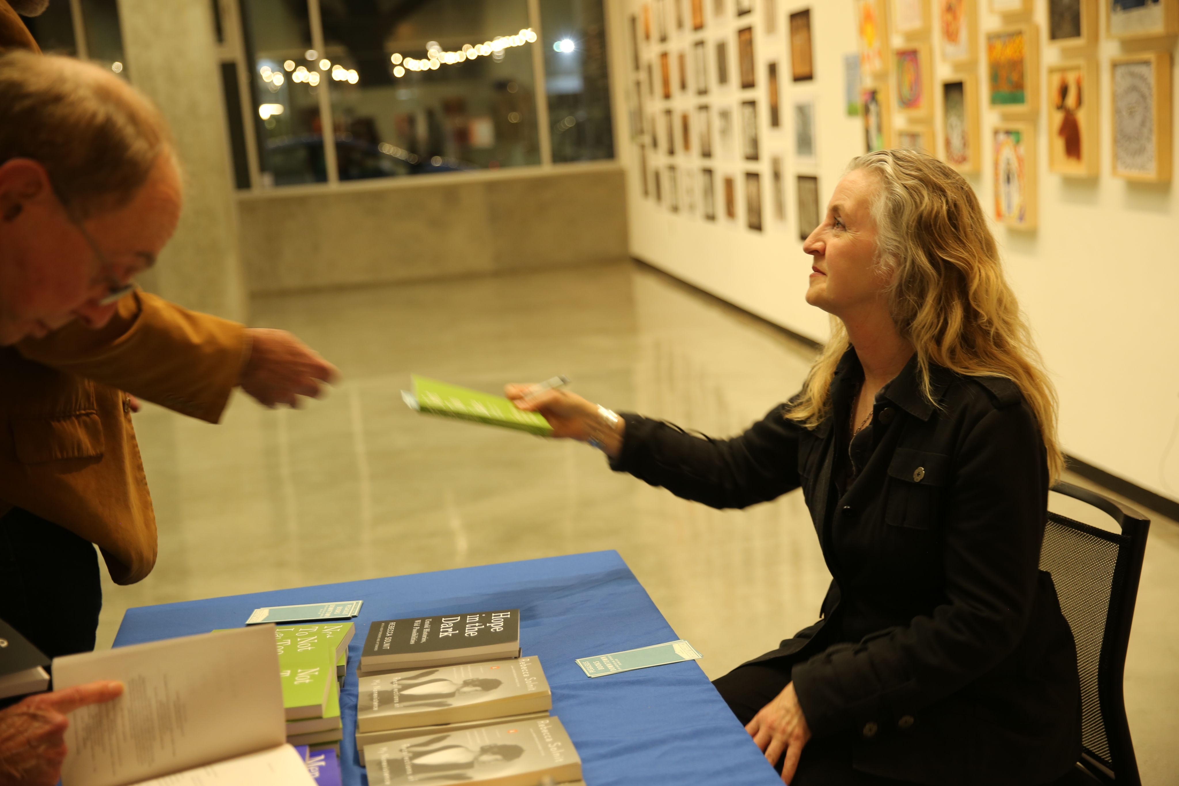 Photo of Rebecca Solnit signing books